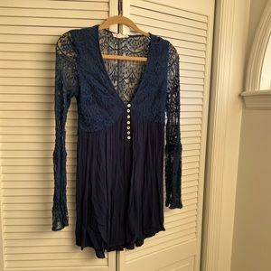 Blue top with lace detail and buttons.